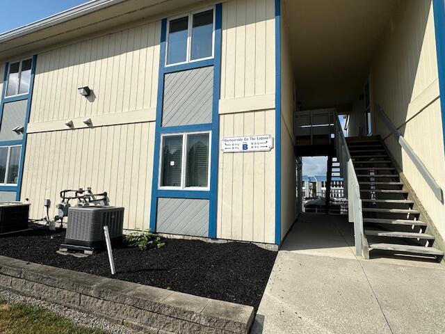 241 Chase Ave Unit B1L, Russells Point, OH 43348 - view of home's exterior featuring stairs and a central AC unit