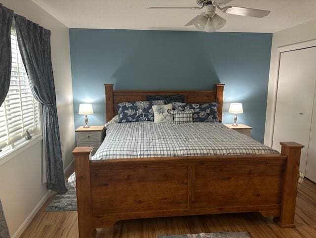 241 Chase Ave Unit B1L, Russells Point, OH 43348 - bedroom with wood finished floors, ceiling fan, and a closet