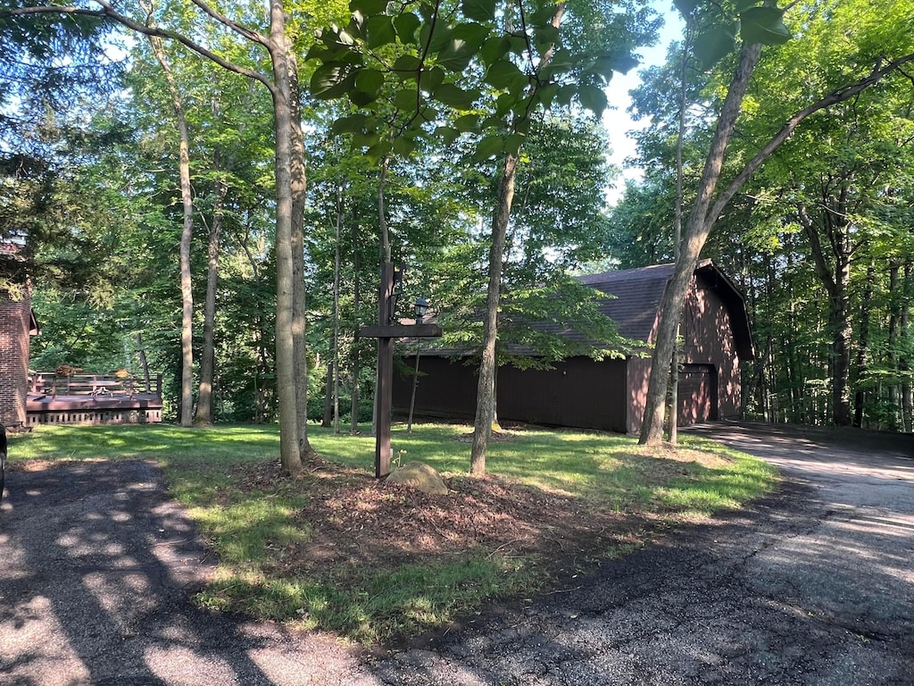 3502 Hazelton Etna Rd, Alexandria, OH 43001 - view of front of property with an outdoor structure, a garage, a barn, a shingled roof, and a front lawn