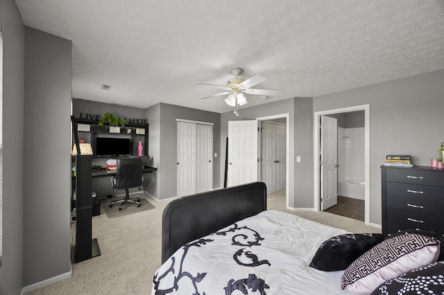 5466 Bull Creek Dr Unit 101, Dublin, OH 43016 - bedroom featuring an office area, carpet flooring, a textured ceiling, a closet, and ceiling fan