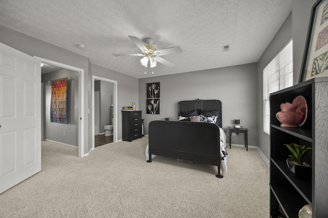 5466 Bull Creek Dr Unit 101, Dublin, OH 43016 - bedroom featuring carpet floors, a ceiling fan, connected bathroom, and a textured ceiling