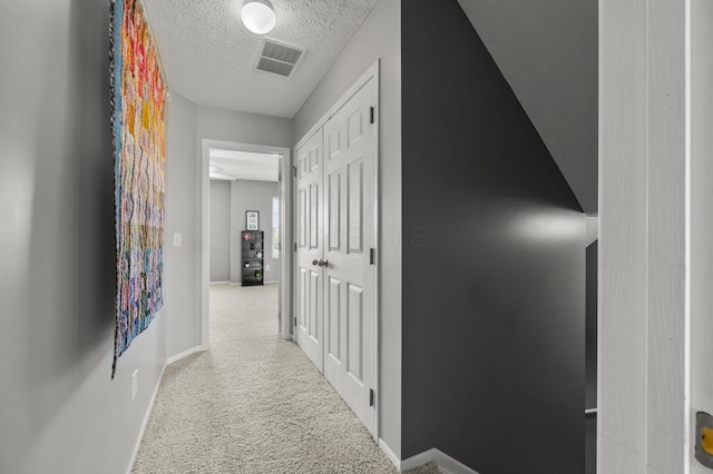 5466 Bull Creek Dr Unit 101, Dublin, OH 43016 - hall featuring a textured ceiling and carpet floors