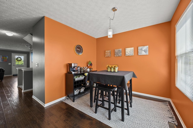 5466 Bull Creek Dr Unit 101, Dublin, OH 43016 - dining room featuring a textured ceiling and hardwood / wood-style floors