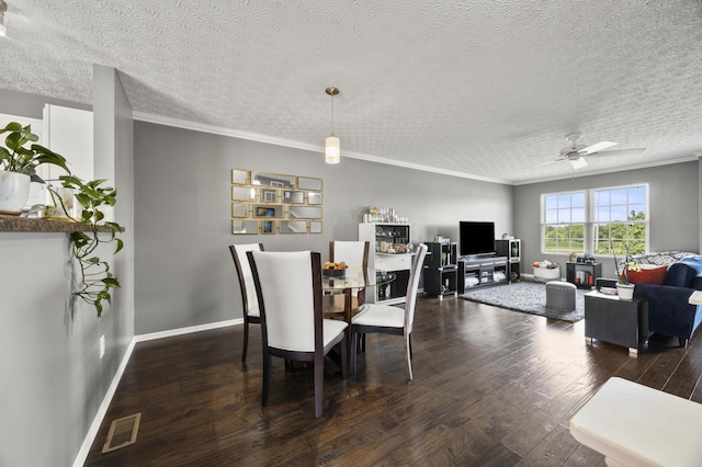 5466 Bull Creek Dr Unit 101, Dublin, OH 43016 - dining space featuring a textured ceiling, hardwood / wood-style flooring, a ceiling fan, and ornamental molding
