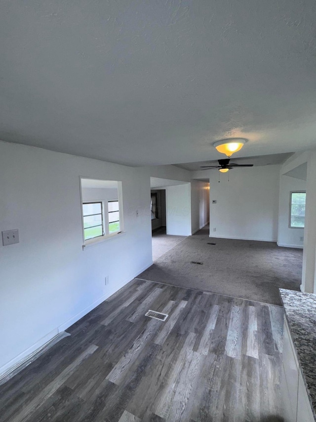 2229 Maureen Blvd N, Obetz, OH 43207 - unfurnished room with wood finished floors, healthy amount of natural light, ceiling fan, and a textured ceiling