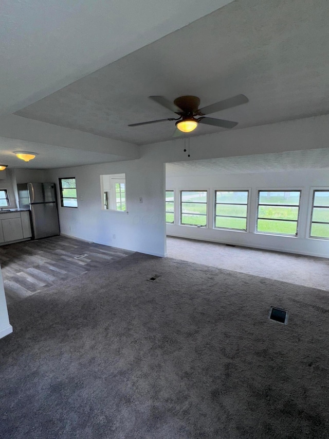 2229 Maureen Blvd N, Obetz, OH 43207 - unfurnished living room with carpet flooring and a ceiling fan