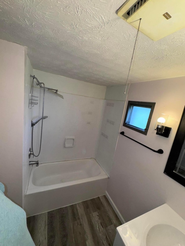 2229 Maureen Blvd N, Obetz, OH 43207 - full bathroom with wood finished floors, a textured ceiling, tub / shower combination, and vanity