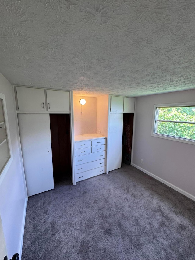 2229 Maureen Blvd N, Obetz, OH 43207 - unfurnished bedroom with a textured ceiling and carpet