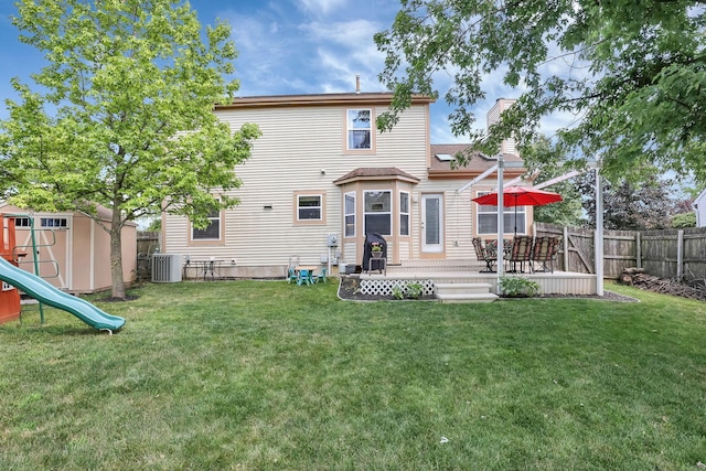 8512 Squad Dr, Galloway, OH 43119 - rear view of house with a fenced backyard, a chimney, a playground, and a patio