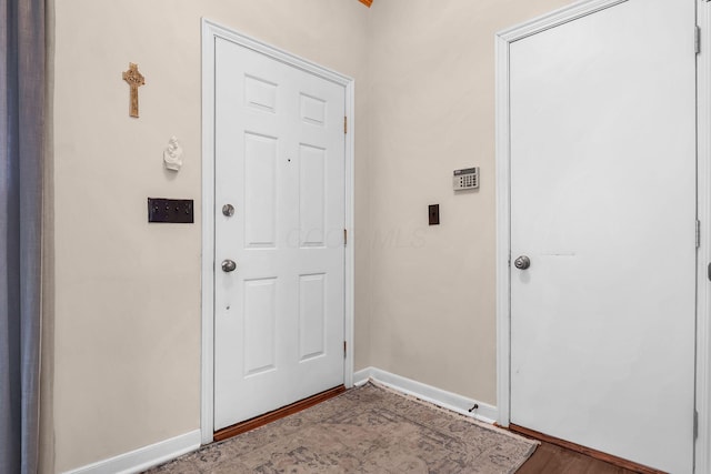 8512 Squad Dr, Galloway, OH 43119 - doorway to outside featuring wood finished floors and baseboards
