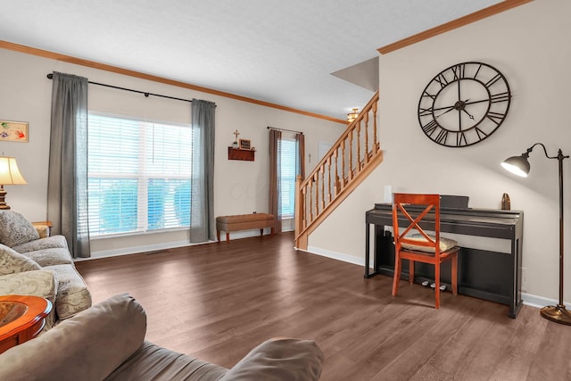 8512 Squad Dr, Galloway, OH 43119 - living room with wood finished floors, stairway, and crown molding