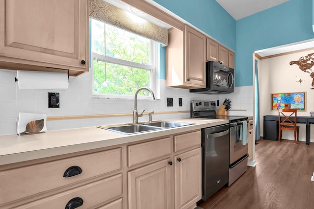 8512 Squad Dr, Galloway, OH 43119 - kitchen featuring appliances with stainless steel finishes, tasteful backsplash, light countertops, and dark wood-style floors