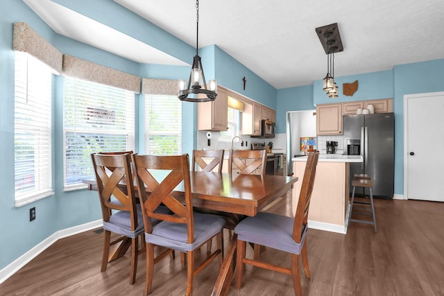 8512 Squad Dr, Galloway, OH 43119 - dining space with dark wood-type flooring and a chandelier