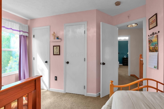 8512 Squad Dr, Galloway, OH 43119 - bedroom with light carpet and multiple closets