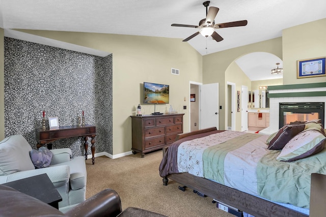8512 Squad Dr, Galloway, OH 43119 - bedroom featuring lofted ceiling, arched walkways, light colored carpet, ceiling fan, and ensuite bathroom