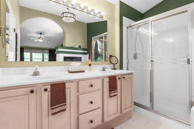8512 Squad Dr, Galloway, OH 43119 - bathroom featuring ceiling fan, a stall shower, and double vanity
