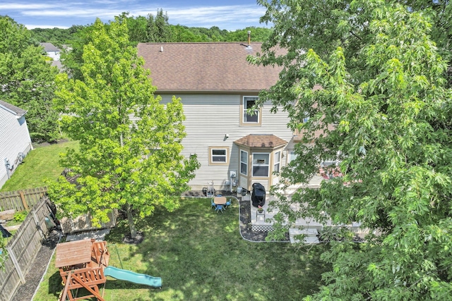 8512 Squad Dr, Galloway, OH 43119 - back of house featuring a fenced backyard, a shingled roof, and a patio area