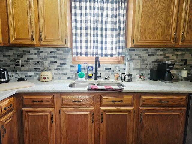 112 N George St, Lancaster, OH 43130 - kitchen with tasteful backsplash, brown cabinetry, and light stone countertops