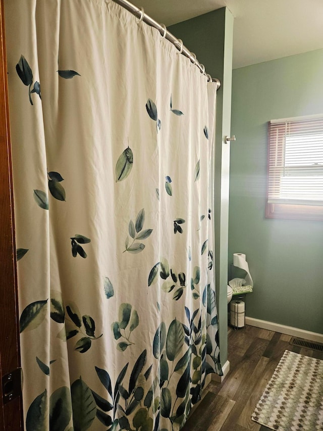 112 N George St, Lancaster, OH 43130 - full bathroom with wood finished floors and a shower with shower curtain