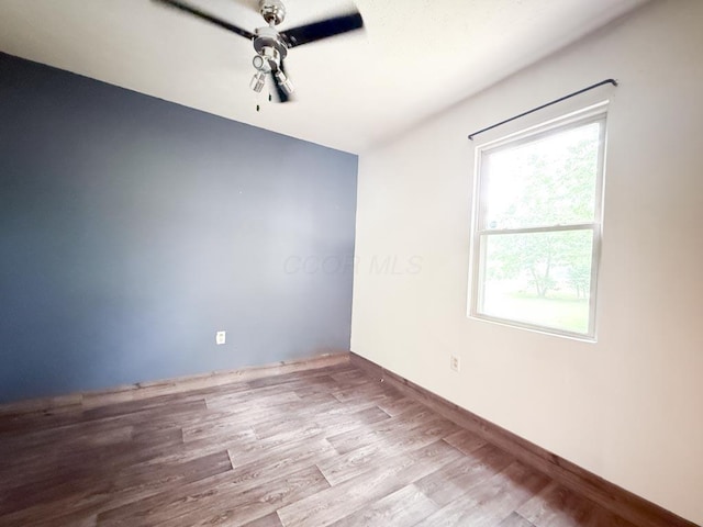 206 William St, Fulton, OH 43321 - spare room featuring wood finished floors and baseboards