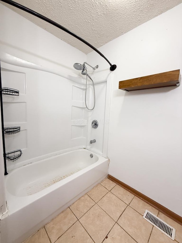 206 William St, Fulton, OH 43321 - full bath featuring shower / tub combination, tile patterned flooring, and a textured ceiling