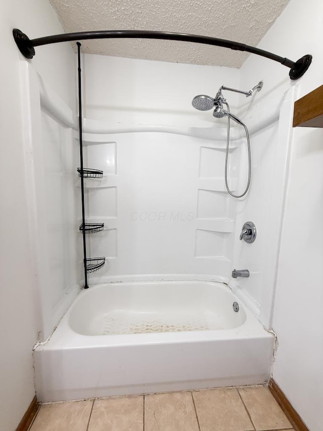 206 William St, Fulton, OH 43321 - full bathroom with bathing tub / shower combination, a textured ceiling, and tile patterned floors