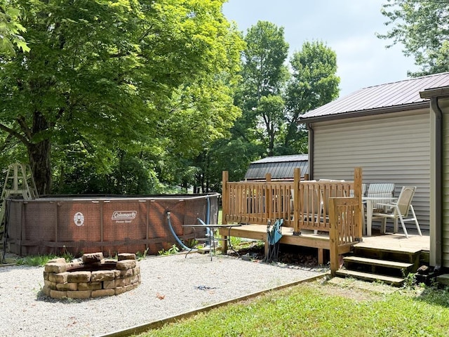 206 William St, Fulton, OH 43321 - view of yard featuring a fire pit and a deck