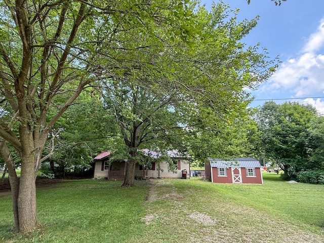 206 William St, Fulton, OH 43321 - view of green lawn featuring a shed