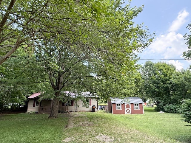 206 William St, Fulton, OH 43321 - view of grassy yard with a shed