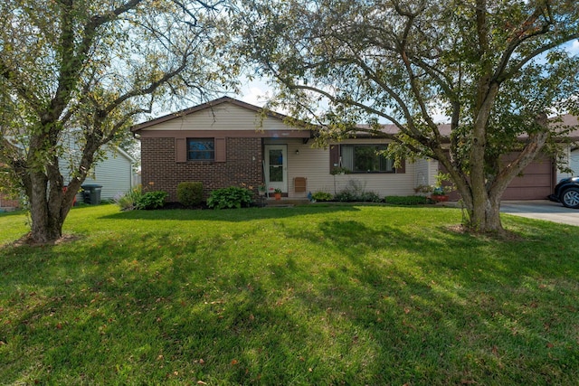 3709 Juniper St, Grove City, OH 43123 - view of front facade with a front lawn, brick siding, driveway, and a garage
