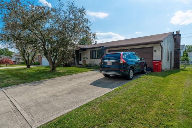 3709 Juniper St, Grove City, OH 43123 - single story home with concrete driveway, a garage, a chimney, and a front lawn