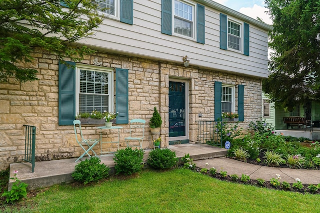 1010 Vernon Rd, Columbus, OH 43209 - view of front of house with stone siding and a front lawn