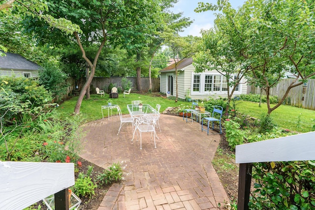 1010 Vernon Rd, Columbus, OH 43209 - fenced backyard with an outdoor structure, outdoor dining area, and a patio area