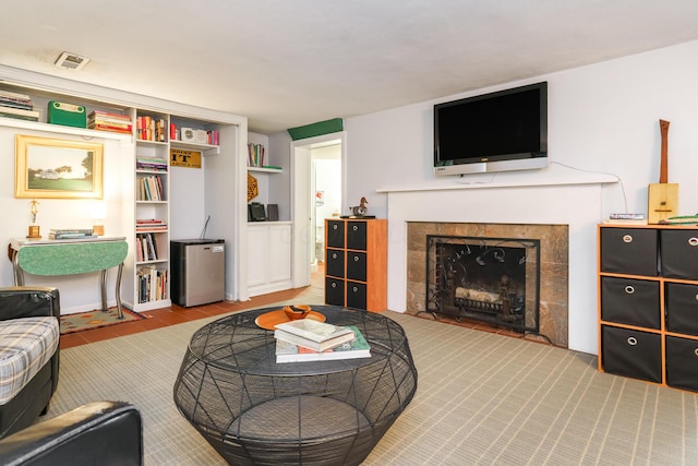 1010 Vernon Rd, Columbus, OH 43209 - living area featuring a tiled fireplace and carpet