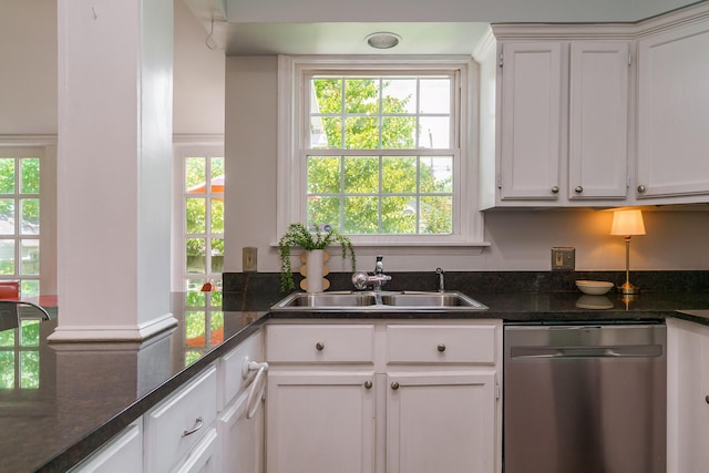 1010 Vernon Rd, Columbus, OH 43209 - kitchen featuring stainless steel dishwasher, plenty of natural light, and white cabinetry