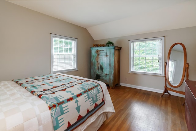 1010 Vernon Rd, Columbus, OH 43209 - bedroom featuring hardwood / wood-style flooring, multiple windows, and vaulted ceiling