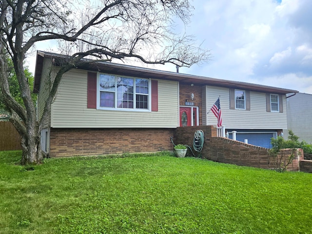 1328 Hilton Dr, Reynoldsburg, OH 43068 - bi-level home with brick siding, an attached garage, and a front yard