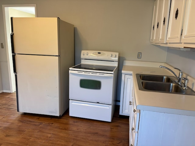 1115 Bermuda Dr, Marion, OH 43302 - kitchen with white appliances, white cabinetry, dark wood-style flooring, and light countertops