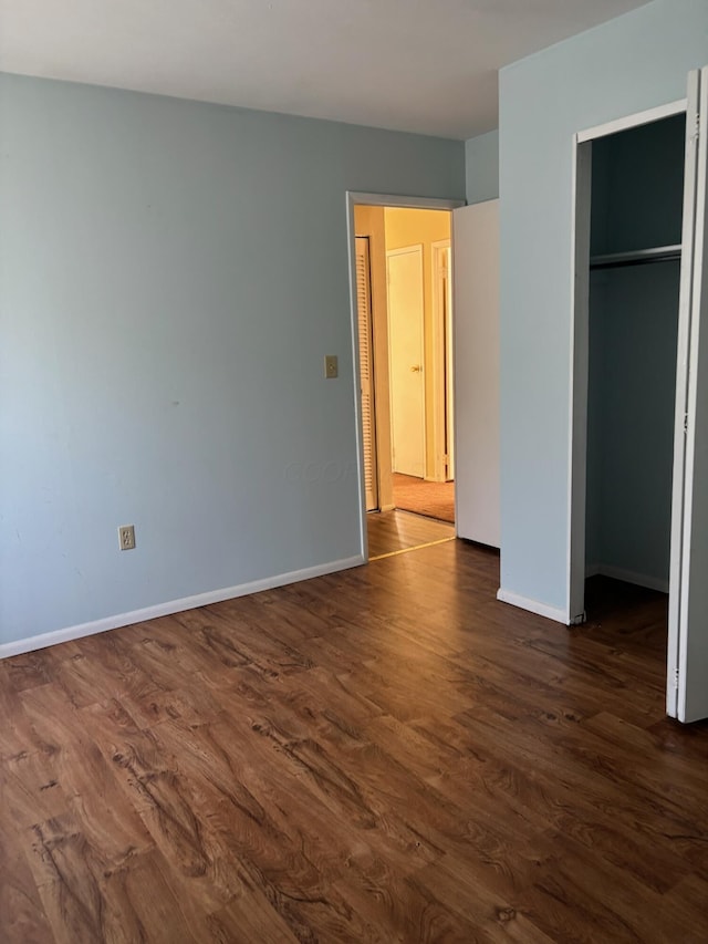 1115 Bermuda Dr, Marion, OH 43302 - unfurnished bedroom with dark wood-style floors and a closet