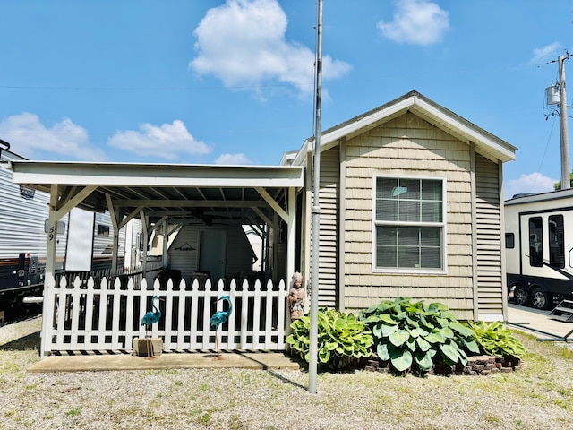 10950 Cherokee Dr Unit 59, Lakeview, OH 43331 - view of front facade with a carport