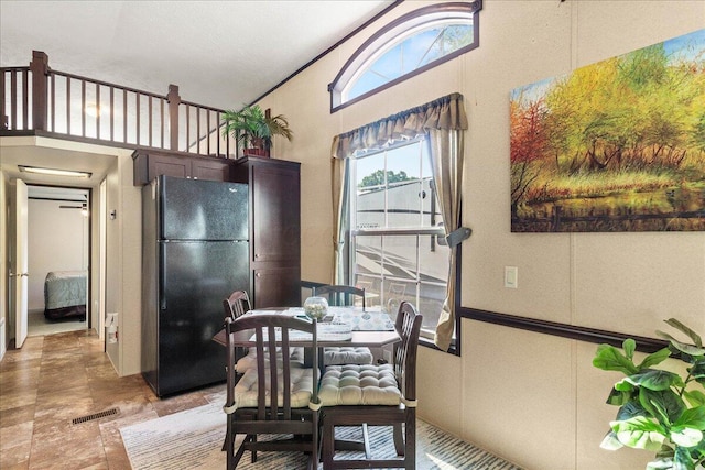 10950 Cherokee Dr Unit 59, Lakeview, OH 43331 - dining space featuring high vaulted ceiling