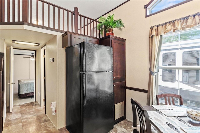 10950 Cherokee Dr Unit 59, Lakeview, OH 43331 - kitchen with freestanding refrigerator, dark brown cabinets, and ceiling fan