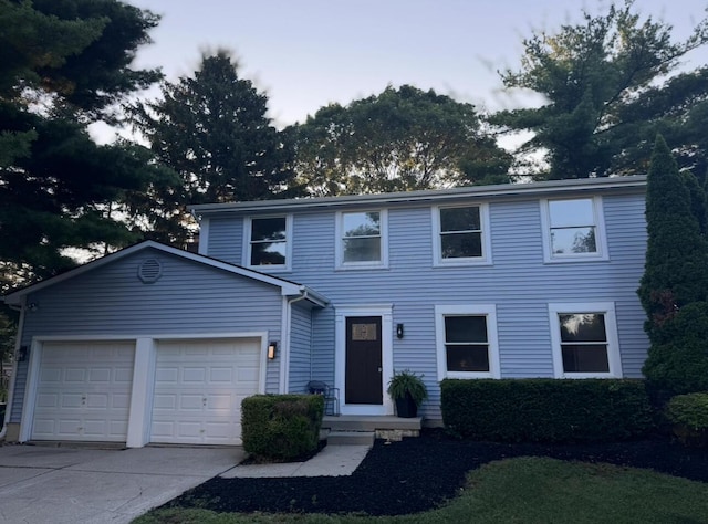 5078 Grassland Dr, Dublin, OH 43016 - view of front of home featuring a garage and concrete driveway