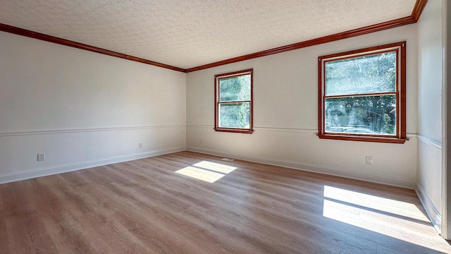 5078 Grassland Dr, Dublin, OH 43016 - spare room featuring wood finished floors, a textured ceiling, and crown molding