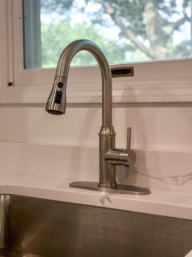 5078 Grassland Dr, Dublin, OH 43016 - detailed view of a sink and white cabinetry