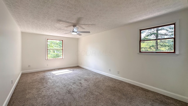 5078 Grassland Dr, Dublin, OH 43016 - empty room with a ceiling fan, carpet, and a textured ceiling