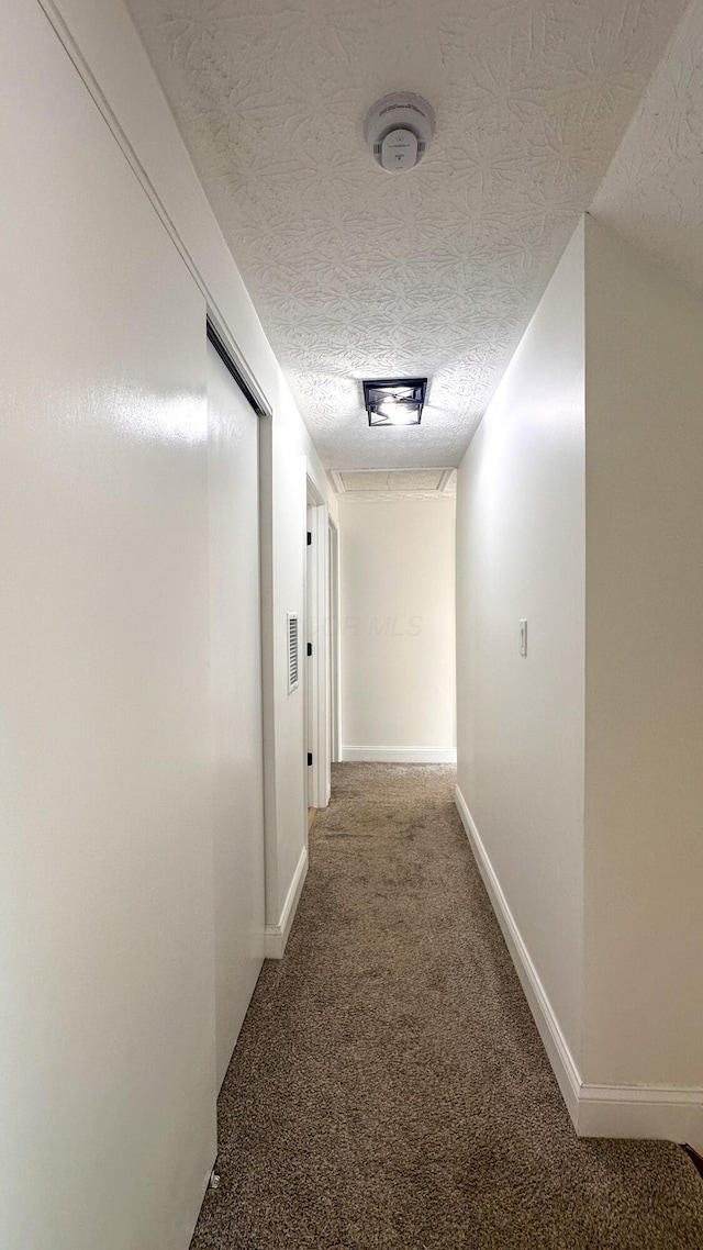 5078 Grassland Dr, Dublin, OH 43016 - hallway featuring carpet flooring and a textured ceiling