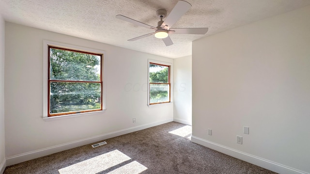 5078 Grassland Dr, Dublin, OH 43016 - carpeted empty room with a textured ceiling and ceiling fan