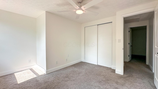 5078 Grassland Dr, Dublin, OH 43016 - unfurnished bedroom with carpet, a textured ceiling, a closet, and a ceiling fan
