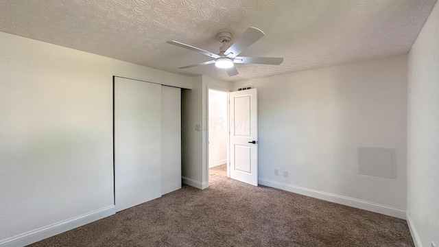 5078 Grassland Dr, Dublin, OH 43016 - unfurnished bedroom with carpet, a closet, a textured ceiling, and ceiling fan
